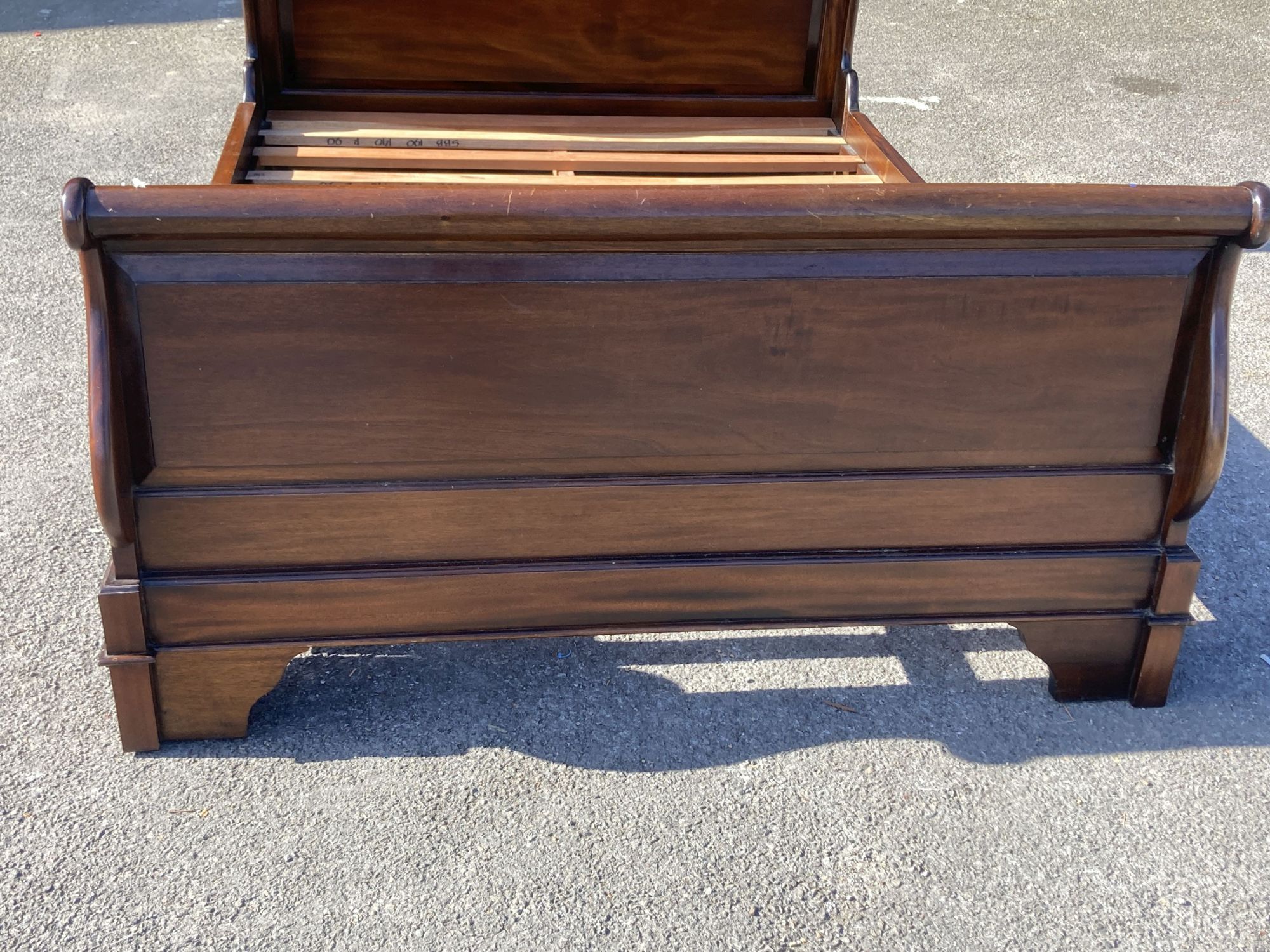 A reproduction mahogany sleigh bed, width 145cm, length 205cm